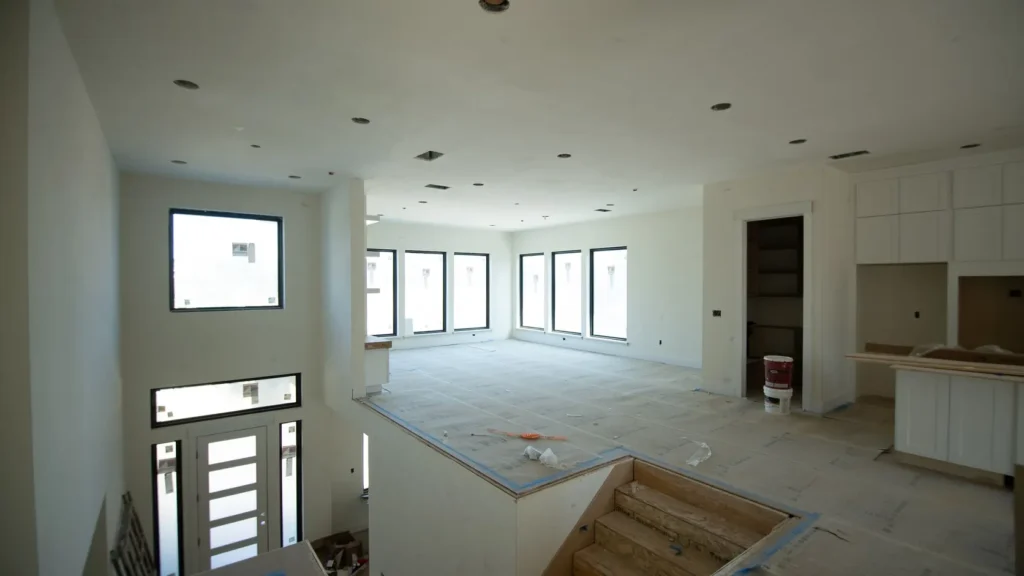 The entry hall and stair during finishing work.