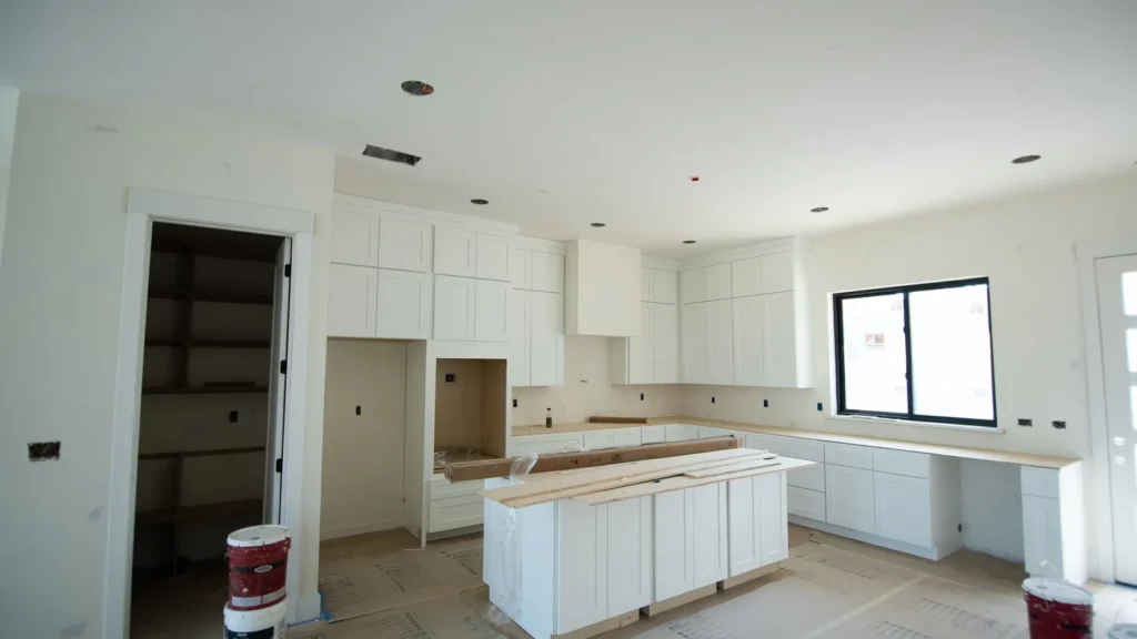 The kitchen, cabinetry installed and awaiting stone.