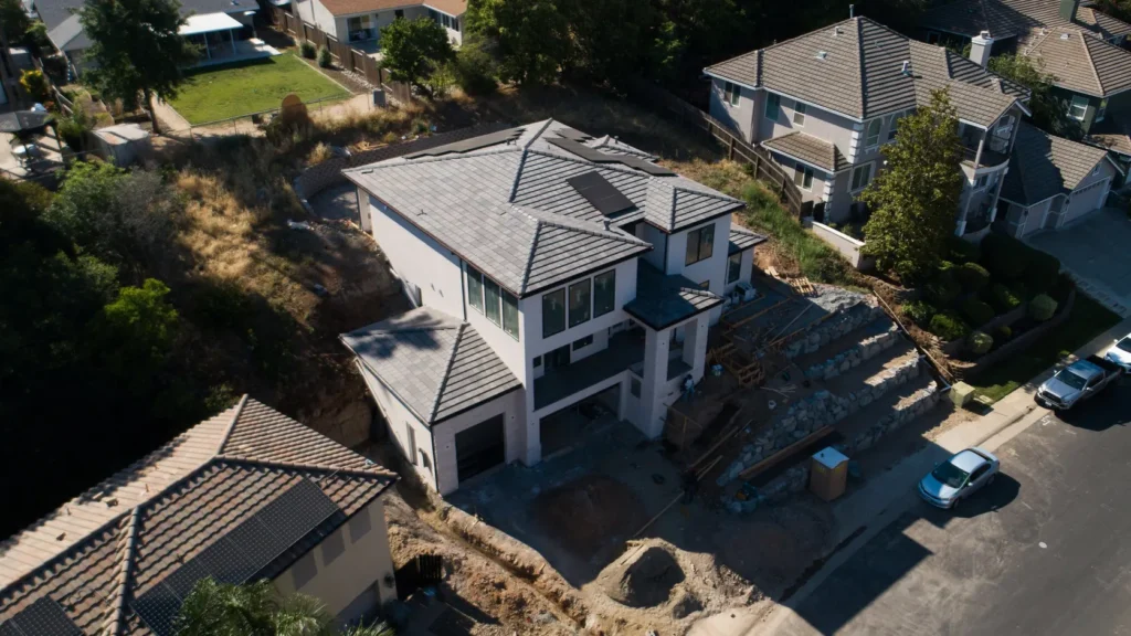 The site from above, the house stepping down the slope.