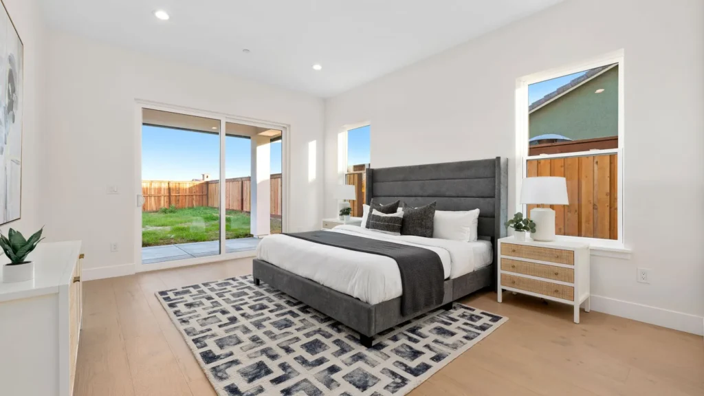 The primary bedroom, with sliding doors onto the rear yard.