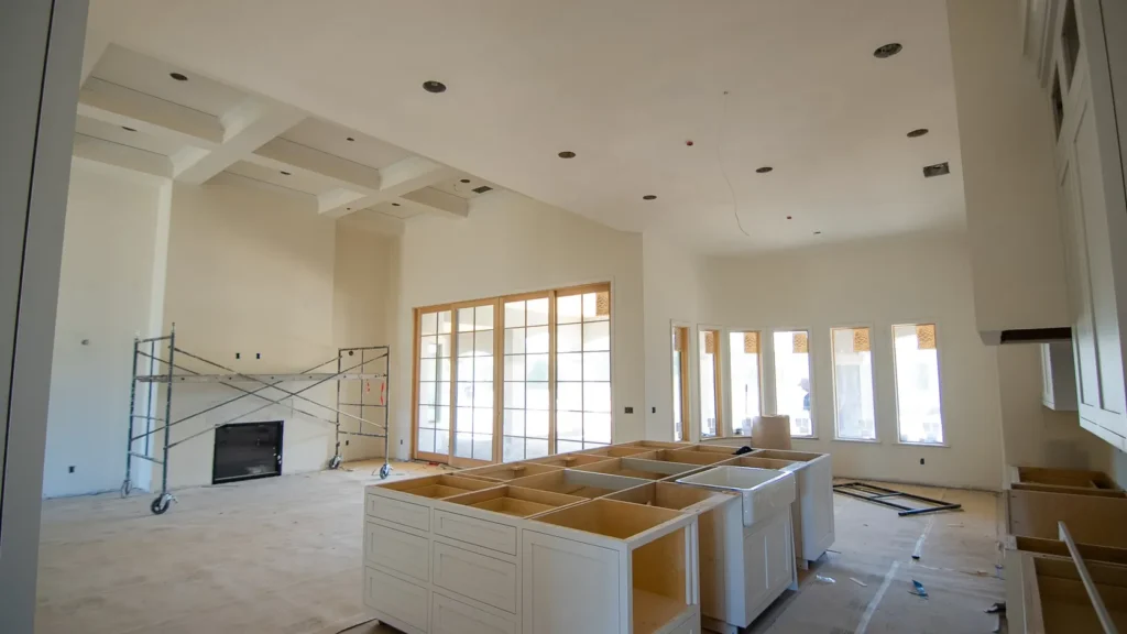 The great room framed out, kitchen island set and windows in.